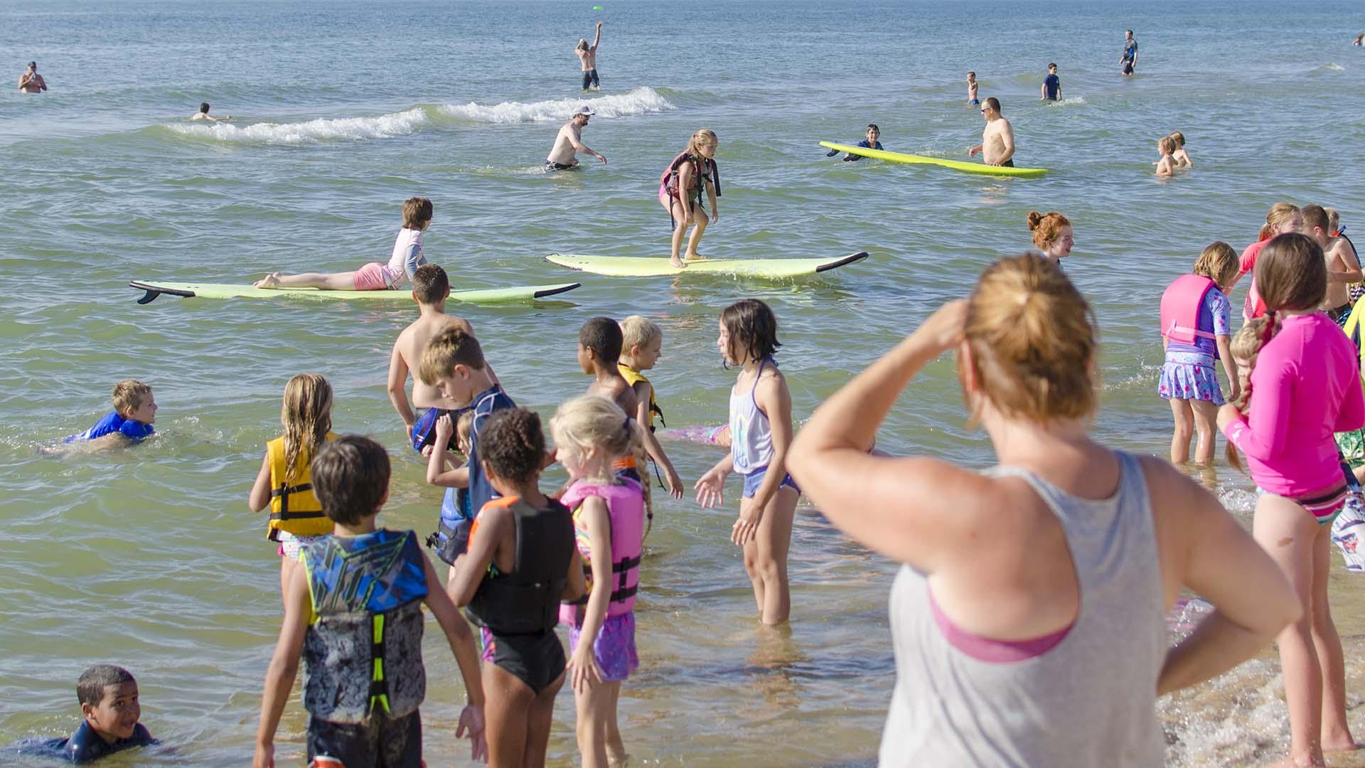 Kids learning to surf