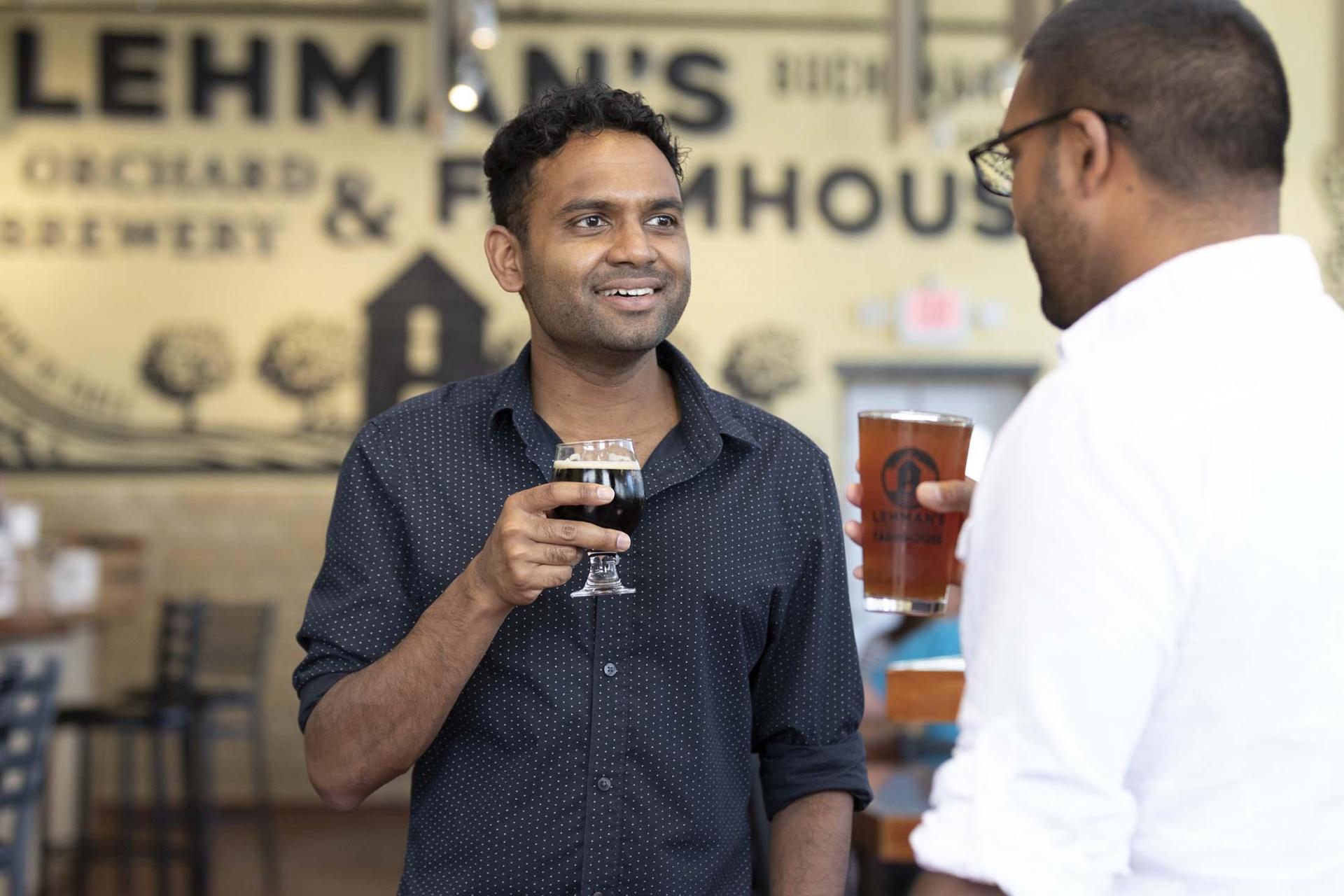 Two people enjoying drinks at Lehman