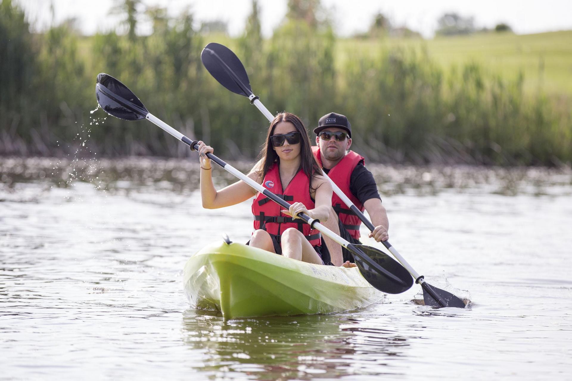 A couple kayaking the Paw Paw River.