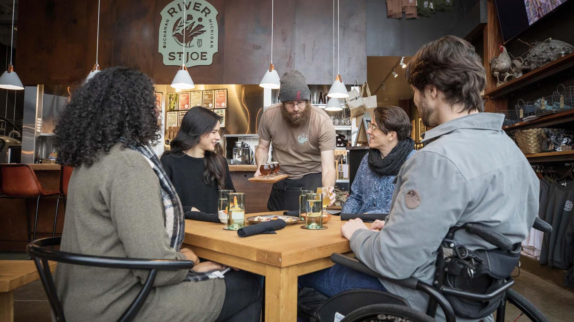 A group of friends enjoying a meal at River Saint Joe.