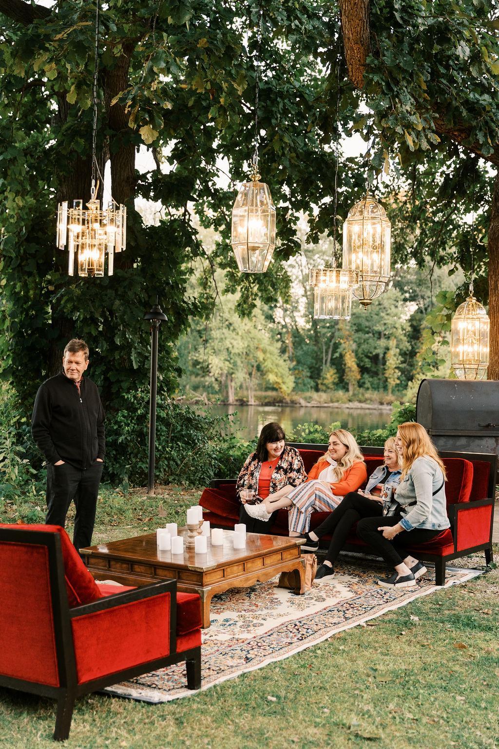 Waterfront lighting using vintage pendants hanging from an old oak tree. 
